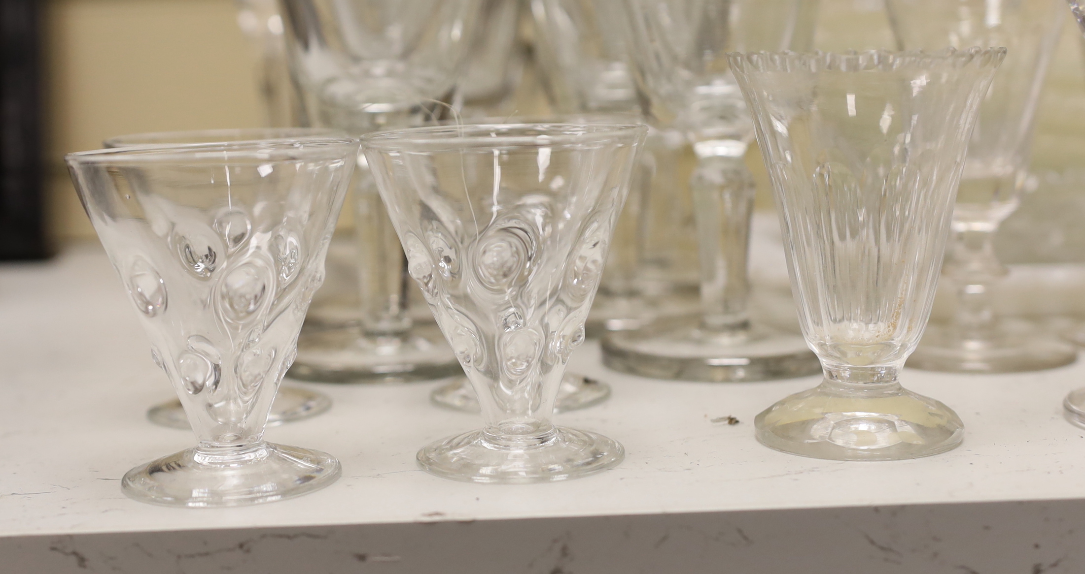 A part suite of etched and silver banded wine glasses together with other glassware